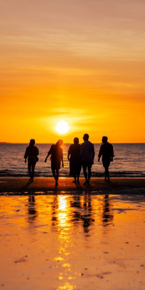 People walking in Mindl Beach at sunset - credit to NT Tourism