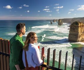 Couple looking out over the 12 Apostles (credit to Tourism Australia)